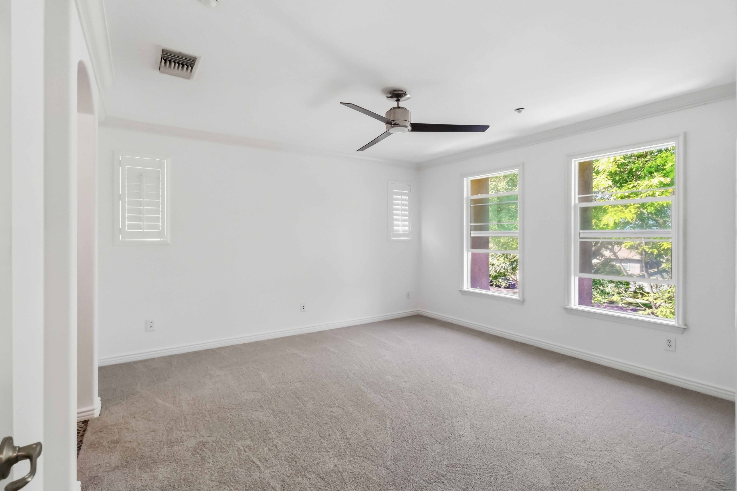 In unit laundry closet with stacked washer and dryer included.